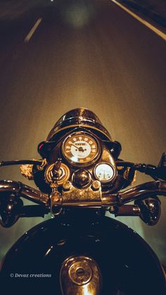 a close up view of the handlebars and clock on a motorcyclist's headlight