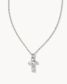 Make it personal with a symbol of what matters to you most. The Cross Pendant Necklace in Silver is a meaningful addition to your everyday collection. Metal Rhodium Over Brass Size 19" chain, 0.66"L x 0.38"W pendant Closure Lobster clasp Please note: Due to the one-of-a-kind nature of the medium, exact colors and patterns may vary slightly from the image shown. | Kendra Scott Cross Pendant Necklace in Silver | Plated Brass/Metal Rhodium Daisy Accessories, Kendra Scott Necklace, Silver Cross Pendant, Cross Pendant Necklace, Stunning Necklace, Silver Cross, Gold Pendant Necklace, Brass Metal, Silver Pendant Necklace