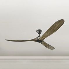 a ceiling fan that is hanging from the ceiling in a room with white walls and ceilings