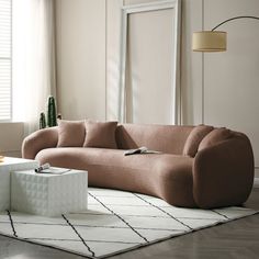 a living room scene with focus on the couch and coffee table in the center area