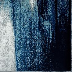 an abstract painting with blue and white colors