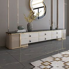 a large mirror on the wall above a dresser in a room with grey walls and gold accents