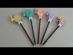 six different colored lollipops sitting on top of each other