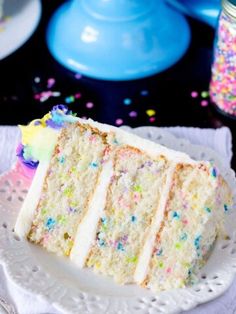 a slice of cake on a plate with sprinkles