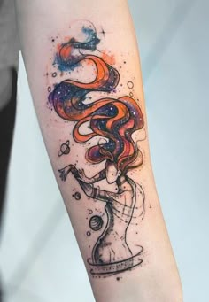 a woman's arm with an abstract tattoo design on it