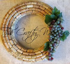 a grape wreath with the words crafty wine written in cursive writing on it