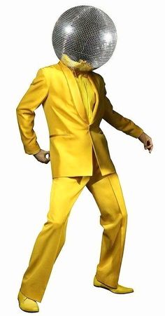 a man in a yellow suit with a disco ball on his head and hands out