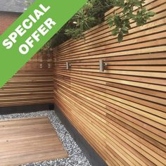 a wooden fence with the words special offer on it and an image of a planter