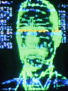 an image of a man's face on a television screen