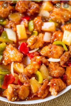 a white bowl filled with meat and vegetables