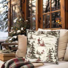 a christmas pillow sitting on top of a couch