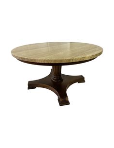 a round wooden table with two legs and a marble top on an isolated white background