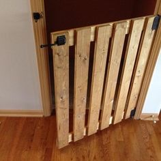 a wooden radiator sitting on top of a hard wood floor next to a door