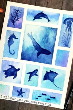 some watercolors are being used to create an ocean scene with dolphins and jellyfish