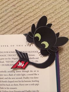 a bookmark with an image of a black cat on it