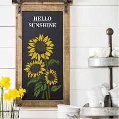 there is a sign that says hello sunshine with sunflowers