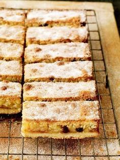 several pieces of cake sitting on top of a cooling rack