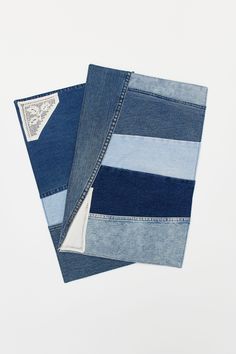 two pieces of blue jean fabric folded on top of each other