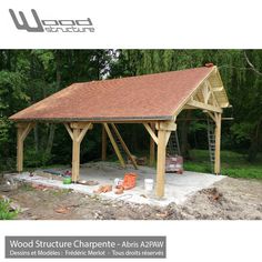 an image of a wooden structure in the woods