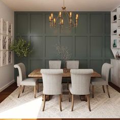 a dining room table with white chairs and a chandelier hanging from the ceiling