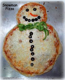 a homemade snowman pizza with olives on it