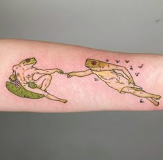 a person with a tattoo on their arm holding onto the arm of another person's arm