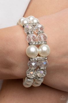 BUY 10 GET 1 FREE Held together by white rhinestone encrusted silver frames, a stretchy pair of bubbly pearl bracelets are infused with white rhinestone encrusted silver rings, iridescent crystal-like beads, and oversized white pearls for a timeless finish. Sold as one individual bracelet. Pink Pearl Bracelet, White Pearl Bracelet, Iridescent Crystal, Bracelet Online, White Bracelets, Red Bracelets, White Rhinestone, Stretchy Bracelets, Colourful Necklace