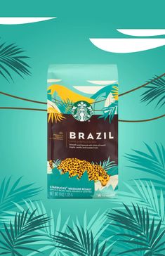 a bag of brazil coffee sitting on top of a green background with palm trees and leaves