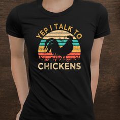 a woman wearing a black t - shirt with the words veri talk to chickens on it