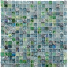 a glass mosaic tile wall with green and blue squares