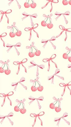 cherries and bows on a white background with pink ribbon around the bow, one cherry has been cut in half