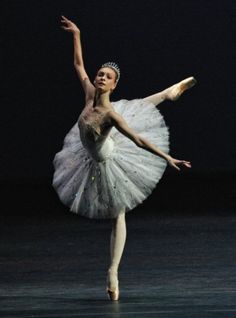 a ballerina in white tutu and tiara