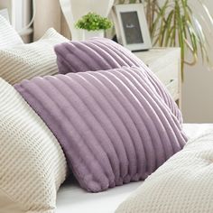 three pillows are stacked on top of each other