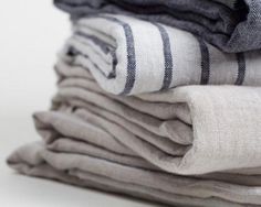 stack of folded linens sitting on top of each other