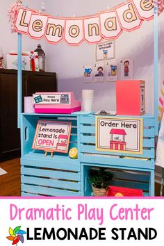 a lemonade stand with the words dramatic play center on it's display shelf