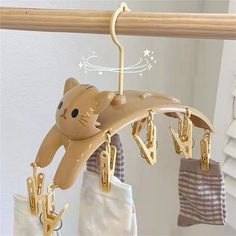 a cat toy hanging from a clothes line