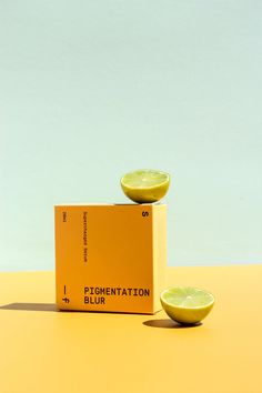 two lemons sitting on top of a box with the word pigmentation blurr