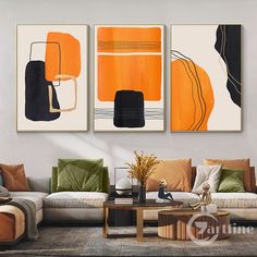 three abstract paintings hang on the wall above a couch in a living room with modern furniture