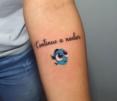 a woman with a tattoo on her arm that reads, continue a nadar and an evil eye