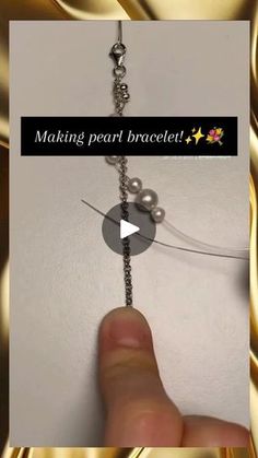 a hand holding a chain with pearls on it and the words making pearl bracelet above it