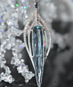 A ladies 14 karat white gold stunning one-of-a-kind pendant set with an elongated pear shape aquamarine measuring 1.75 inches long and 5/16 inches wide and weighing 11.26 carats.  Also set in the pendant are 101 round brilliant cut diamonds having a total weight of 1 carat.  The overall length of the pendant is 2.50 inches.  Does not include chain. Jewelry Aquamarine, Glass Menagerie, Butterfly Fashion, Bottle Diy, Cute Engagement Rings, Jewelry Wardrobe, Celebrity Engagement Rings, Aquamarine Jewelry, Diamond Anniversary Rings