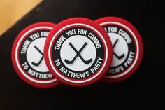 three red and white buttons with hockey stickers on them that say thank you for coming to the rink