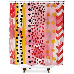 a shower curtain with red, yellow and black designs on it's side in front of a white background