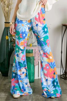 This Item is Final Sale Unleash your wild side with our Everlane Multi Print Flare Pants! These bell bottom pants are not your average pair, with a mix of floral prints that are sure to turn heads. The elastic waist ensures a comfortable fit while the flare design adds a touch of retro style. 95% Polyester & 5% Spandex Blue Stretch Flares For Summer, Summer Stretch Blue Flares, Trendy Blue Summer Flares, Hippie Style Wide Leg Floral Print Pants, Hippie Style Floral Print Wide Leg Pants, Hippie Wide Leg Floral Print Bottoms, Hippie Wide Leg Bottoms With Floral Print, Hippie Flare Bottoms For Spring, Hippie Wide-leg Bottoms With Floral Print