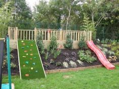 a backyard with a slide and artificial grass