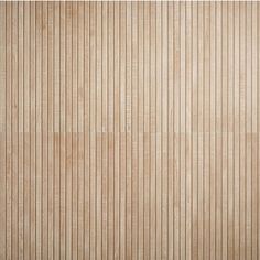 a wooden paneled wall with vertical lines on the bottom and sides in light brown