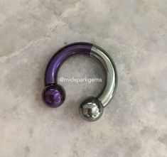 I decided to combine two of my most popular colors together into one titanium septum ring that is anodized Half Silver and Half Dark Purple. The jewelry is hand-anodized by me, and it's made of solid titanium. The anodized coloring is achieved with electricity instead of dyes or paints. That means the color will not chip off or irritate your skin. Your jewelry will be made to order to match the colors pictured in this listing. The price is for a SINGLE barbell. * Internally threaded * Both ends unscrew * Choose ball or spike ends * Choose from:      - 12 gauge (2.0mm)      - 10 gauge (2.5mm)      - 8 gauge (3.0mm)      - 7 gauge (3.5mm)      - 6 gauge (4.0mm)      - 5 gauge (4.5mm)      - 4 gauge (5.0mm) * High quality titanium: Ti-6AL-4V-ELI ASTM F136 For more reference photos of specific 4g Septum, 8g Septum, 6g Septum, Septum Piercing Jewelry, Circular Barbell, Belly Button Jewelry, Cool Piercings, Plug Earrings, Septum Jewelry