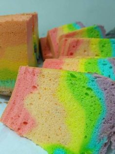 there are several pieces of cake that have been dyed with different colors and patterns on them