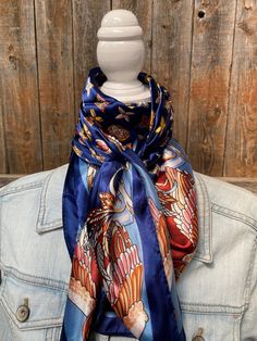 "Our classic wild rag/scarf in a blue color is accented with a multi-floral pattern. It is a square and measures 35\" x 35\". It is sure to add a bright pop of color to any outfit. Western or Crystal slides available to accent 100% machine washable polyester, silky and soft." Blue Bandana Scarf As Gift, Blue Bandana As Gift, Blue Shawl Scarves For Spring, Blue Scarves For Spring, One Size, Blue One Size Scarves For Spring, One Size Blue Scarves For Spring, Blue Silk Scarf As Gift, Bohemian Blue Bandana Scarf, Bohemian Blue Scarf Bandana