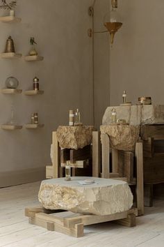 two stone sinks sitting next to each other in a room